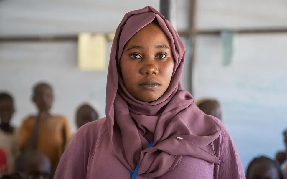 Eine Freiwillige aus einem kinderfreundlichen Ort | © UNICEF/UNI941833/Jamal Eine junge Frau frontal